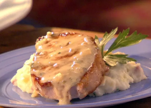 Pork chops in creamy Champagne sauce with rustic garlic mashed potatoes Recipe | Food Network UK