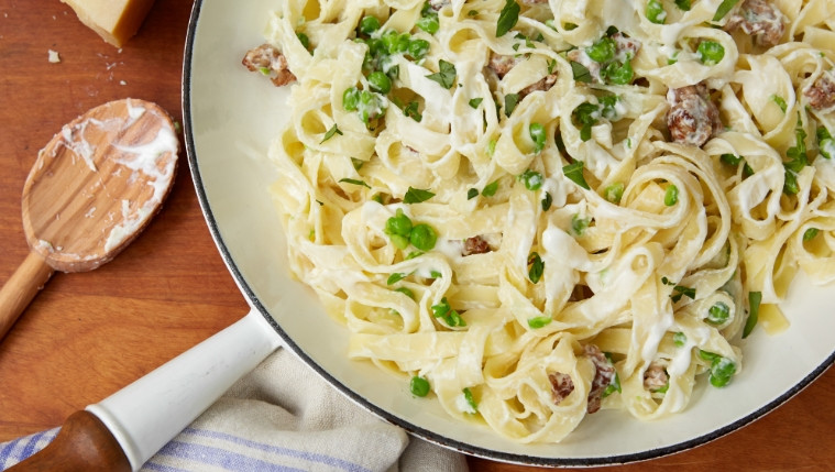 Tagliatelle with Smashed Peas, Sausage, and Ricotta Cheese Recipe | Food Network UK