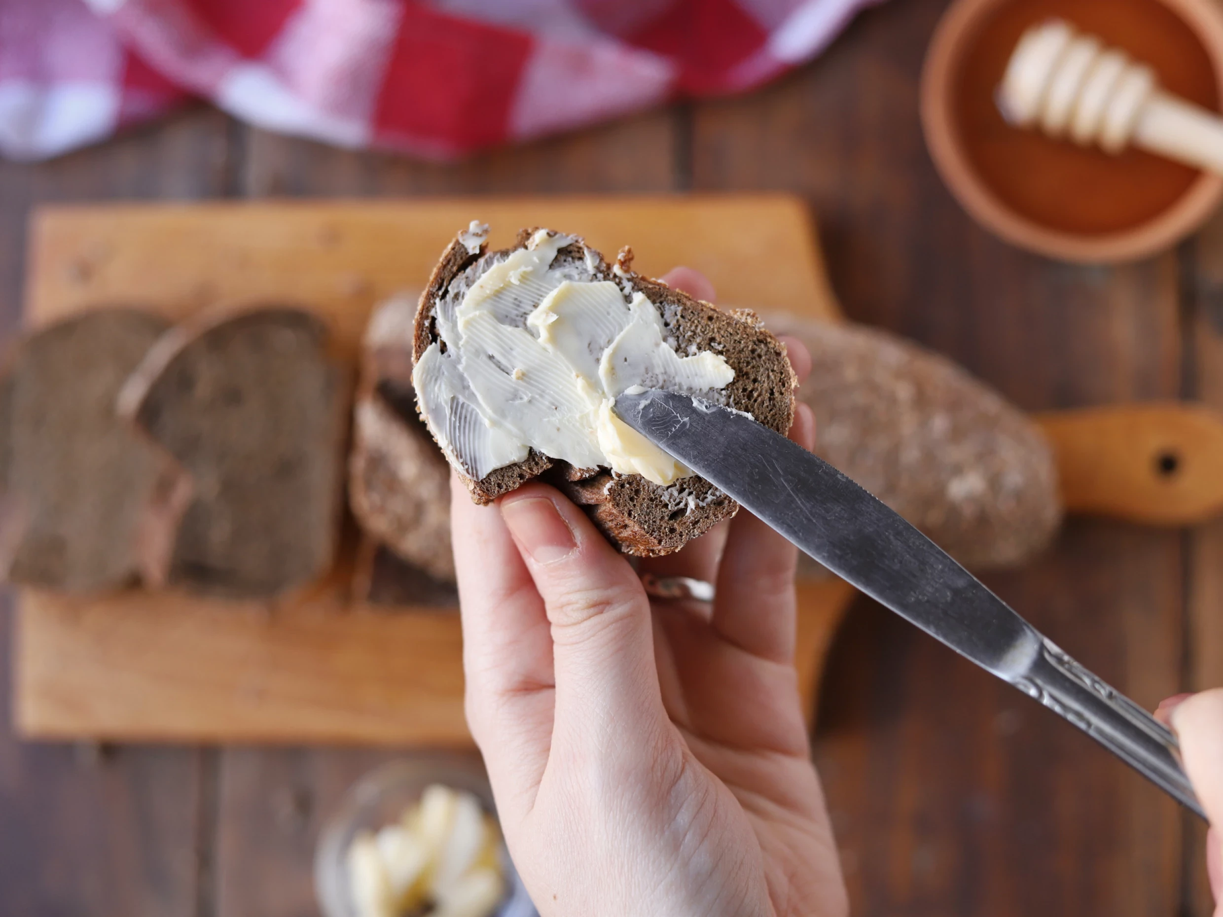 butter being spread onto soda bread with a knife